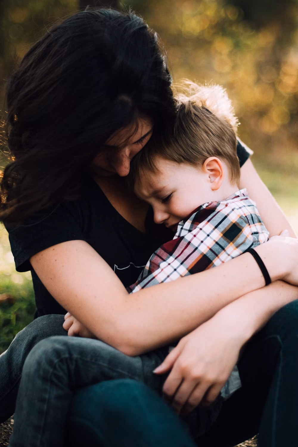 child being held by their mother